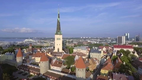 Aerial panning of St Olaf church and Tallinn old town fortifications Stock Footage 82376053