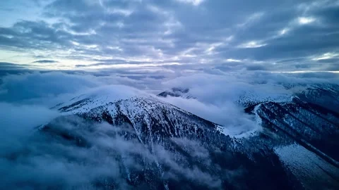 Aerial Panning Timelapse of Dramatic Winter Cloud Inversion over Mountain Peaks Stock Footage 325435360