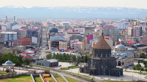 Aerial panning view Kars mosque with city panorama in eastern Turkiye Stock Footage 233117949