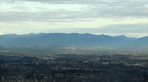 Aerial Panning View of Mountain Range and Clouds Stock Footage 10577576