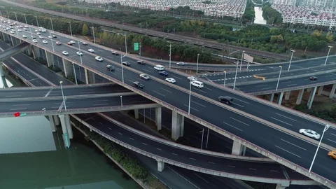 Aerial panning view of road junction with moving cars. Road interchange or Video stock 119840403