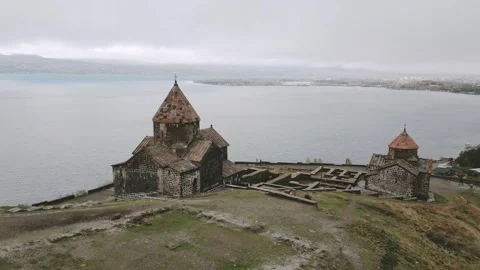 Aerial panning view Sevanavank monastic complex. Peninsula at the northwest.. Stock-Footage 290068202