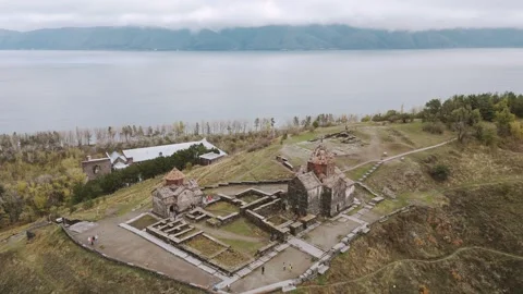 Aerial panning view Sevanavank monastic complex. Lake Sevan in the Gegharku.. 스톡 동영상 312086094