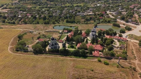 Aerial Panorama of Capriana Monastery Surrounded by Rural Moldova Видео 345113597