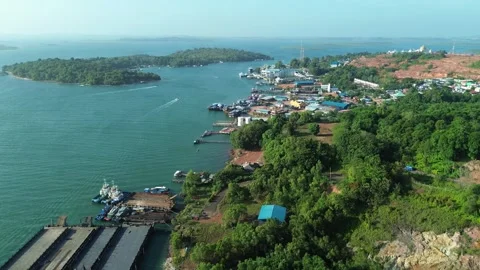 Aerial panorama capturing a dynamic tropical port with active docks, vibran.. Video stock 326181299