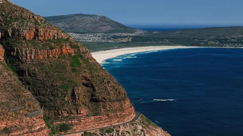 Aerial panorama of Chapman's Peak cliffs and Noordhoek coastline Stock Footage 339181997