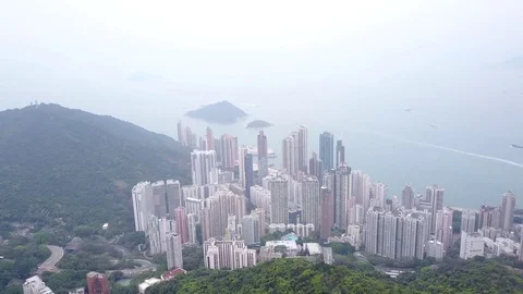 Aerial panorama from Mount Devis peak to Kennedy Town, light fog in air Stock Footage 77063411