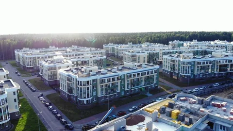 Aerial panorama of new modern apartment buildings with children's playground Stock Footage