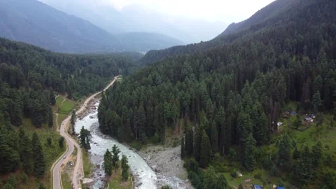 Aerial panorama of Pahalgam valley surrounded by Kashmir’s breathtaking green Stock Footage 310656198