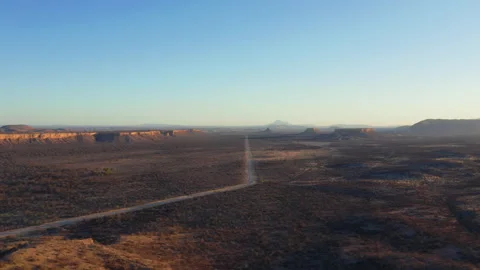 Aerial panorama of the Ugab Valley in Namibia at sunset with a straight road 動画素材 341397973