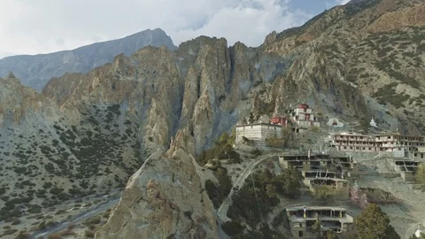 Aerial panoramia over sharp crest cliffs with solituded Braga monastery, Nepal Stock Footage 124682128