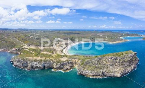 Aerial panoramic by drone of cliffs surrounding Half Moon Bay washed by Stock Photos