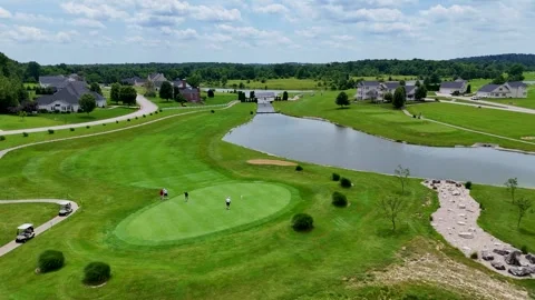 Aerial Panoramic Drone Orbit of Golf Course Green and Carts Stock Footage 337657436