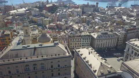 Aerial panoramic drone view of buildings and streets surrounding Port of Genoa. Video stock 154658396