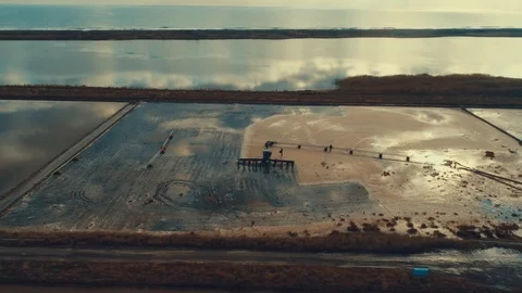 Aerial panoramic drone view of Pomorie salt pans townscape at sunse. Видео 119721315