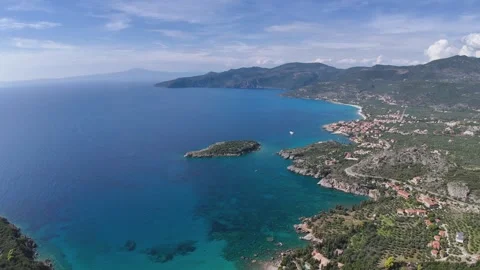 Aerial Panoramic Drone View of Turquoise Bay with Small Island and Village Stock-Footage 331084155