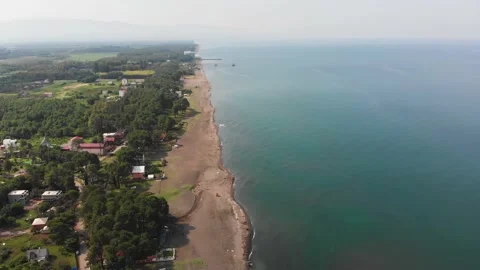 Aerial panoramic fly over black sea shore in Shekvetili village with beauitif Stock Footage 145694843