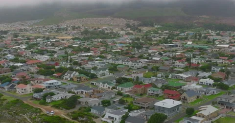 Aerial panoramic footage of buildings in rectangular street network of Kleinmond 스톡 동영상 172156244