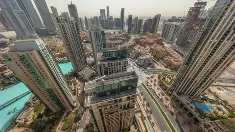 Aerial panoramic look down view with sunrise over big futuristic city. Busine Stock Photos
