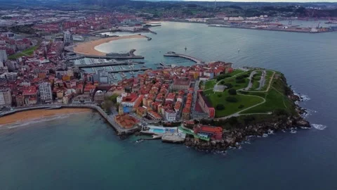 Aerial panoramic orbit of Cerro de Santa Catalina and Gijón bay Stock Footage 328385231