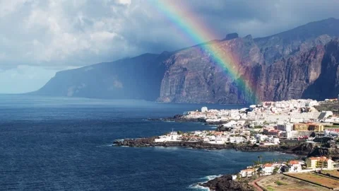 Aerial panoramic rainbow over volcanic coast in Tenerife Stock Footage 325790141