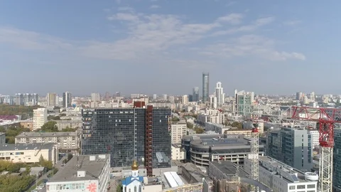 Aerial panoramic shot of construction cranes in city. Sunner sunny day Stock Footage 126424257