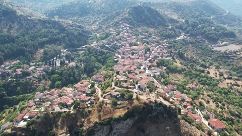 Aerial panoramic shot of Dimitsana surrounded by forests and hills Stock Footage 343947804
