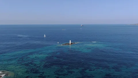 Aerial Panoramic shot with a drone on the lighthouse in Sardinia Stock Footage 115432633