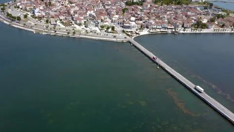 Aerial panoramic shot of long bridge leading to Aitoliko island Greece Stock Footage 337048647