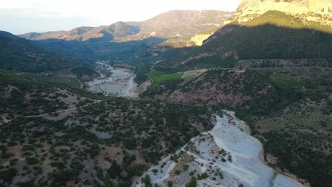 Aerial panoramic shot of a river winding in a mountain valley Stock Footage 343962440
