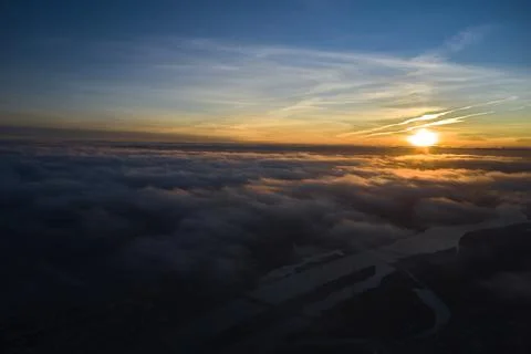 Aerial Panoramic skyline view at golden hour sunset during cloudy skies Stock Photos