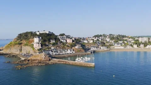 Aerial panoramic video of Pleneuf-Val-Andre, a coastal town, showing the sandy Stock Footage 346722930