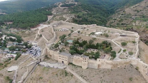 Aerial panoramic view of the ancient citadel Naryn-Kala, fortress wall. Stock Footage 314816313