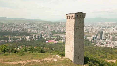 Aerial panoramic view ancient Svan stone tower above Tbilisi skyline and Tu.. Stock Footage 311220378