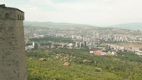 Aerial panoramic view ancient Svan stone tower above Tbilisi skyline and Tu.. Stock Footage 311265256
