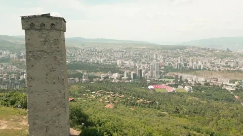 Aerial panoramic view ancient Svan defensive old tower above Turtle Lake, o.. Stock Footage 311265529