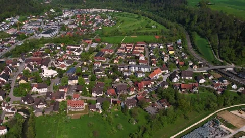 Aerial panoramic view around the old town of Zwingen  in Switzerland Stock Footage 308794454