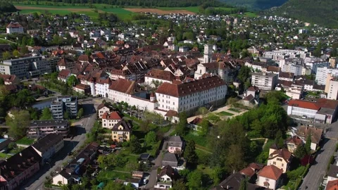 Aerial panoramic view around the old town of Delemont  in Switzerland Stock Footage 308804917
