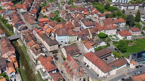 Aerial panoramic view around the old town of Moudon  in Switzerland Vídeo Stock 308814600