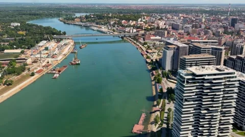 Aerial panoramic view of Belgrade river and traffic crossing bridge. Urban Stock Footage 338055045