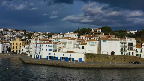 Aerial panoramic view of Cadaques Spain. seagulls fly close to the camera. Video Vídeo Stock 102613192