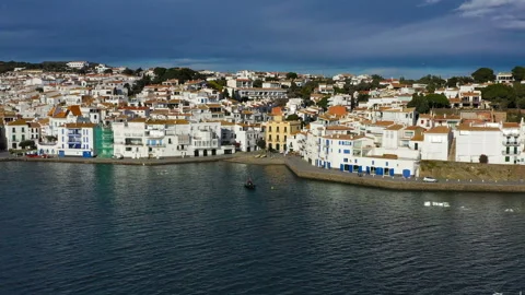 Aerial panoramic view of Cadaques Spain. seagulls fly close to the camera. Video Vídeo Stock 103423048