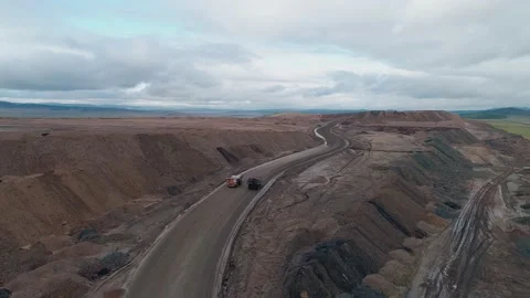 Aerial panoramic view of a coal mining quarry. Heavy mining machinery and dump Stock Footage 171762360