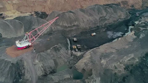 Aerial panoramic view of a coal mining quarry. Heavy mining machinery and dump Stock Footage 171762812