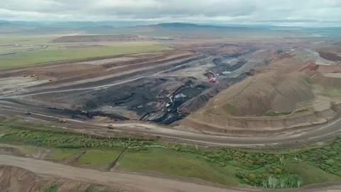 Aerial panoramic view of a coal mining quarry. Heavy mining machinery and dump Stock Footage 171762937