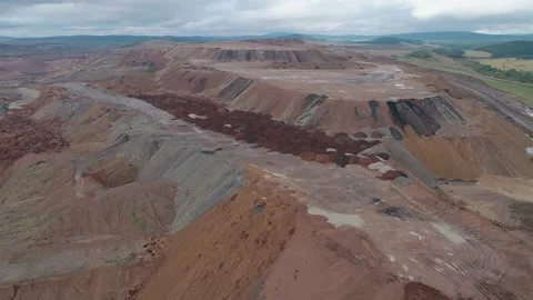 Aerial panoramic view of a coal mining quarry. Heavy mining machinery and dump Stock Footage 171763197