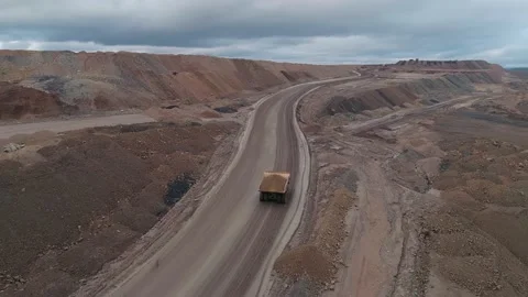 Aerial panoramic view of a coal mining quarry. Heavy mining machinery and dump Stock Footage 171763442