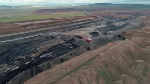 Aerial panoramic view of a coal mining quarry. Heavy mining machinery and dump Stock-Footage 171763622