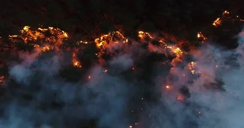 Aerial panoramic view of a forest fire at night, heavy smoke causes air Stock Footage 201932707