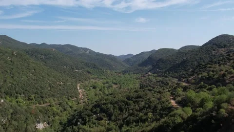 Aerial panoramic view of forest valley and mountain wilderness Stock Footage 343945885
